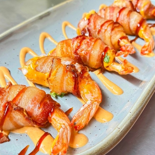 Shrimp Wrap : Juicy shrimp, wrapped in crispy bacon and filled with rich melted cheddar cheese. Each bite offers a delightful combination of smoky and creamy flavors.